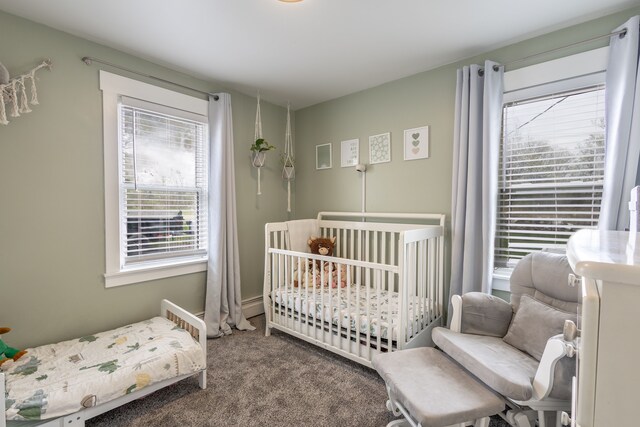 carpeted bedroom featuring multiple windows