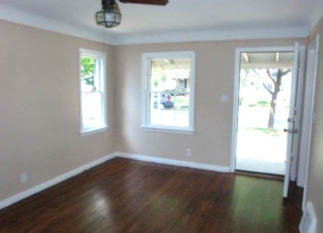19724 Elkhart St, Harper Woods, MI 48225 - interior space featuring a ceiling fan, baseboards, and dark wood finished floors
