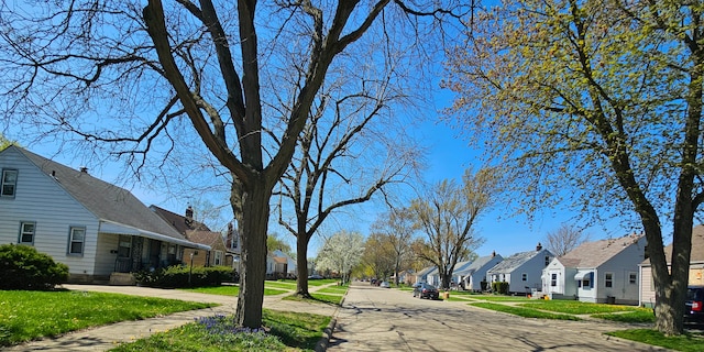 19724 Elkhart St, Harper Woods, MI 48225 - view of street with a residential view, sidewalks, and curbs