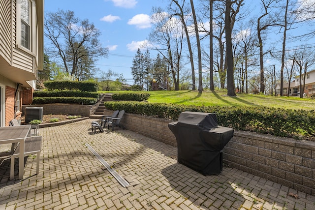 view of patio / terrace featuring grilling area, stairs, and cooling unit