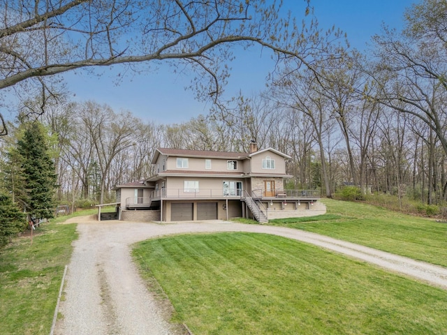 traditional-style home featuring a chimney, dirt driveway, a front lawn, an attached garage, and stairs