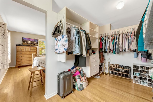 spacious closet with wood finished floors