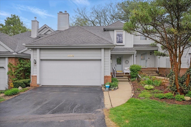 view of front of property featuring aphalt driveway, an attached garage, brick siding, a chimney, and a shingled roof