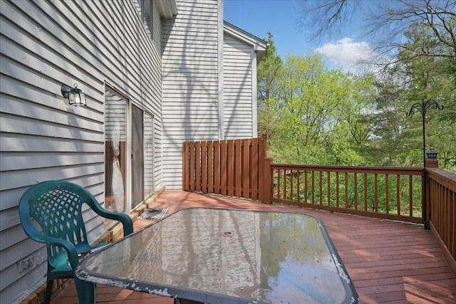 deck with outdoor dining area