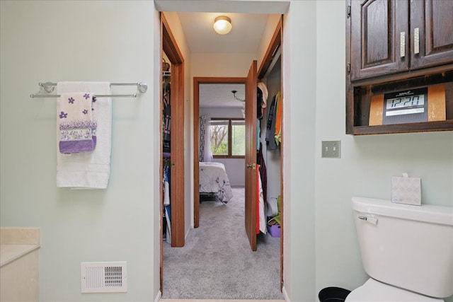 bathroom featuring toilet and visible vents