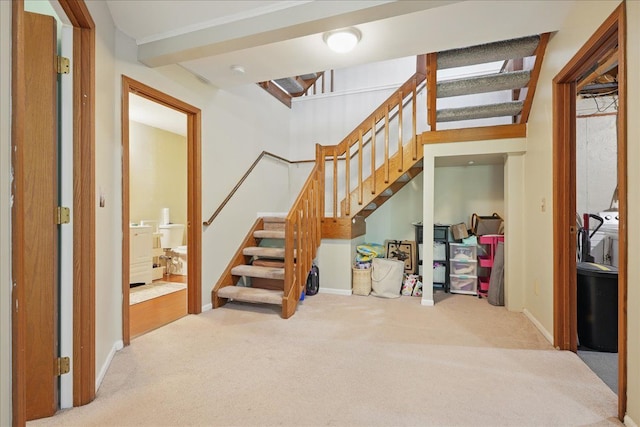 stairway featuring carpet flooring and baseboards