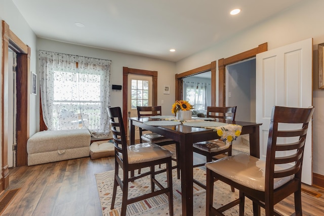 dining area featuring recessed lighting and wood finished floors