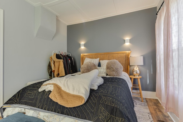 bedroom with wood finished floors
