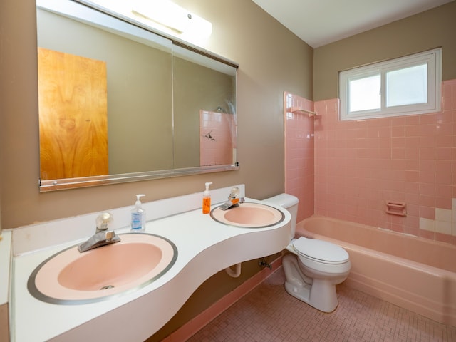 full bath featuring toilet, tile patterned floors, shower / washtub combination, and vanity