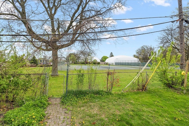 view of yard featuring a gate and fence