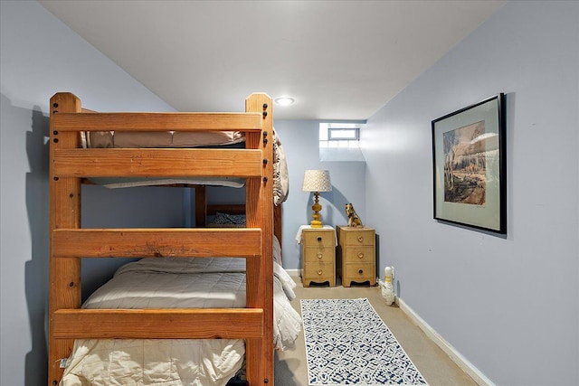 bedroom with baseboards and carpet floors