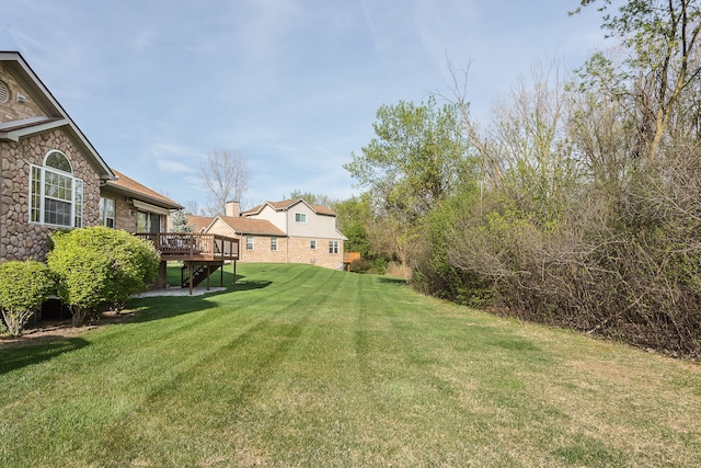 view of yard featuring a deck