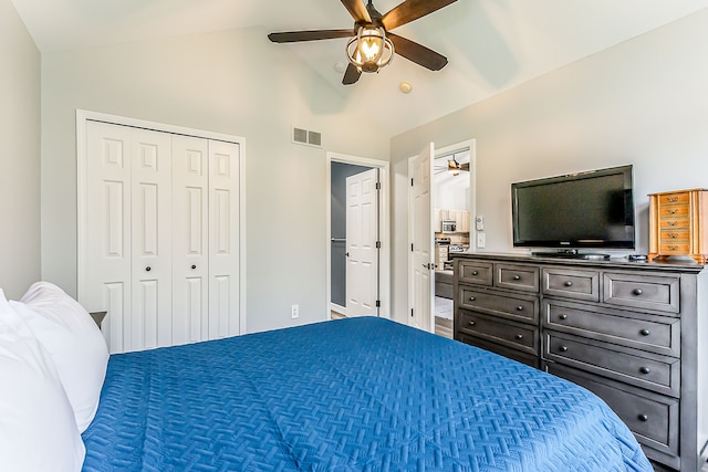 bedroom with high vaulted ceiling, ceiling fan, a closet, and visible vents