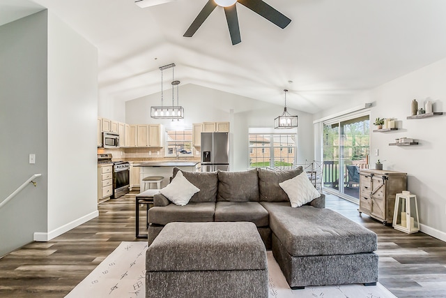 living room with baseboards, a ceiling fan, dark wood finished floors, and lofted ceiling