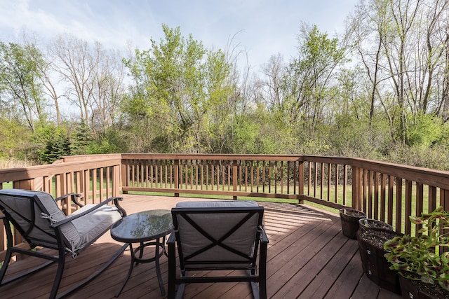 wooden deck featuring outdoor dining area