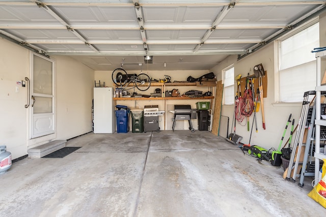 garage featuring a garage door opener