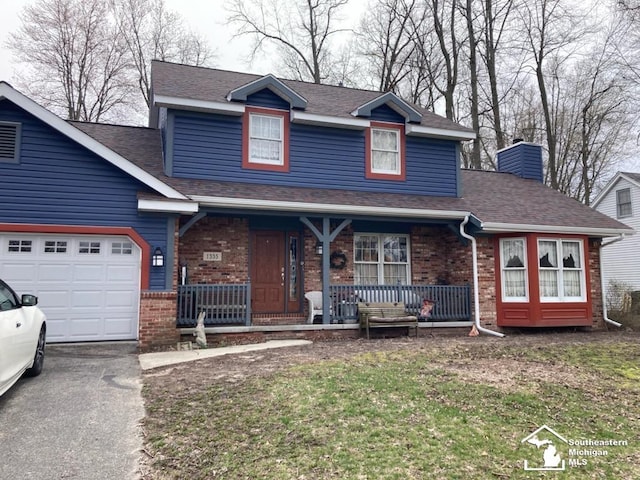 view of front of home with a garage, covered porch, a chimney, and brick siding