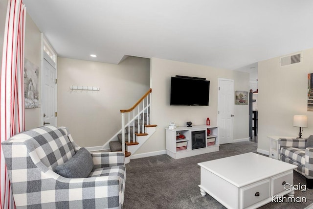 2464 Abbington Dr SE, Grand Rapids, MI 49506 - living area with visible vents, stairs, baseboards, dark colored carpet, and recessed lighting