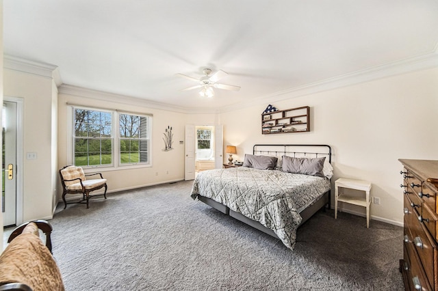 bedroom featuring a ceiling fan, baseboards, ornamental molding, and carpet