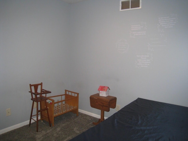 carpeted bedroom with visible vents and baseboards