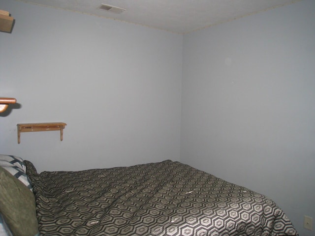 bedroom featuring visible vents