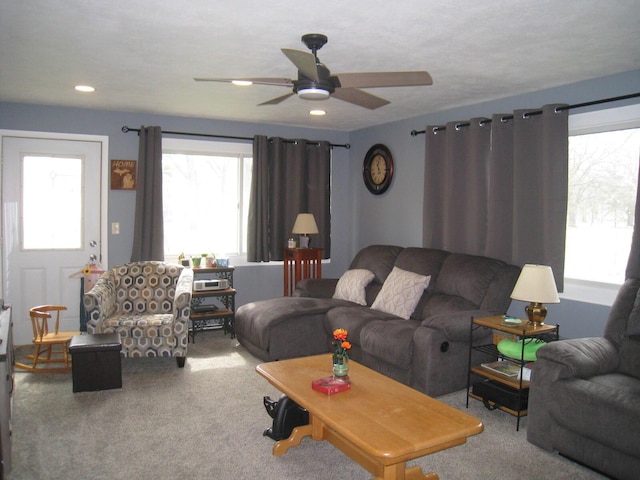 carpeted living room with ceiling fan and recessed lighting