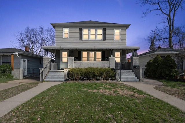 view of front of home featuring a yard and a porch