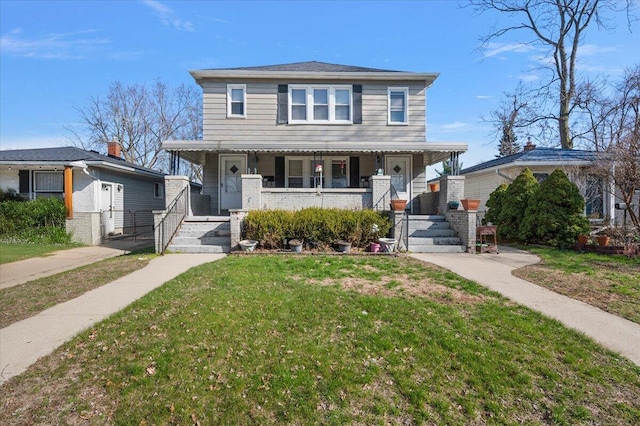 view of front of home with a porch and a front lawn