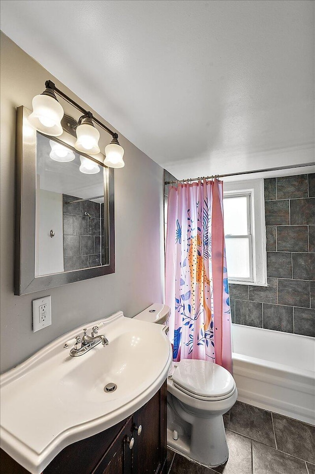 bathroom with toilet, tile patterned floors, shower / tub combo with curtain, and vanity