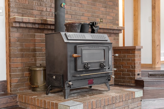 4824 Little Cedar Creek Dr, Attica, MI 48412 - detailed view of a wood stove and brick wall