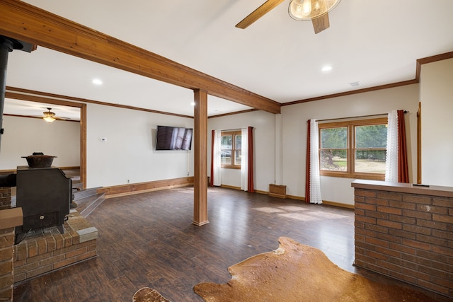 4824 Little Cedar Creek Dr, Attica, MI 48412 - unfurnished living room with a ceiling fan, a wood stove, crown molding, baseboards, and wood finished floors