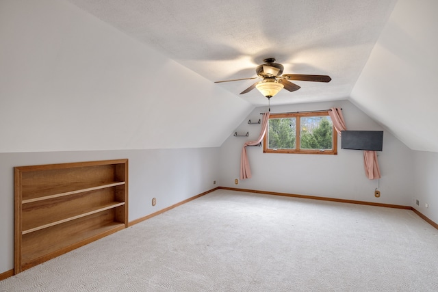 4824 Little Cedar Creek Dr, Attica, MI 48412 - bonus room featuring carpet, lofted ceiling, a ceiling fan, baseboards, and built in shelves
