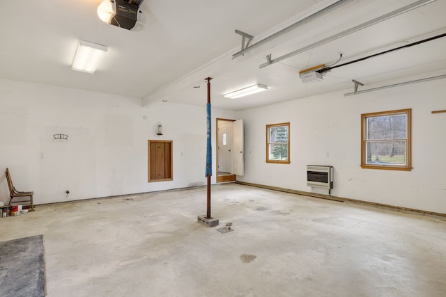 4824 Little Cedar Creek Dr, Attica, MI 48412 - garage with heating unit and a garage door opener