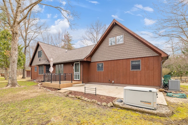 4824 Little Cedar Creek Dr, Attica, MI 48412 - back of house featuring central AC unit, a wooden deck, a patio area, a lawn, and a shingled roof