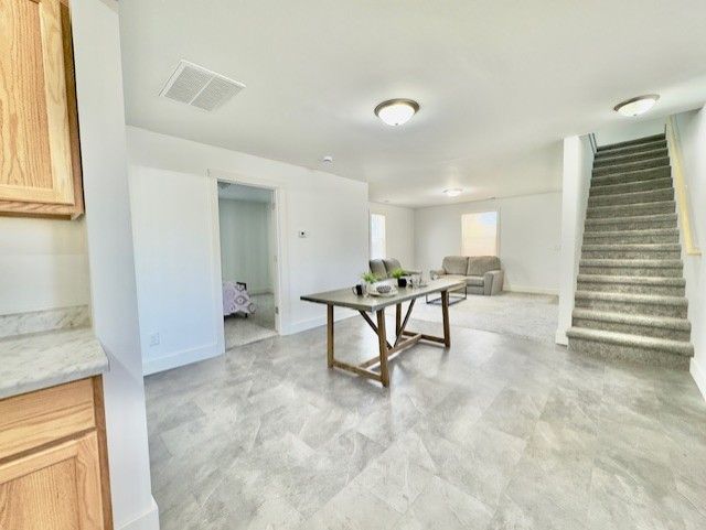 rec room with baseboards and visible vents