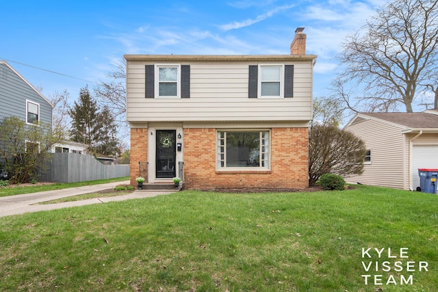 colonial inspired home featuring brick siding, a front lawn, fence, and a chimney