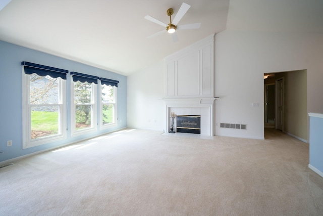 unfurnished living room with visible vents, ceiling fan, and light colored carpet