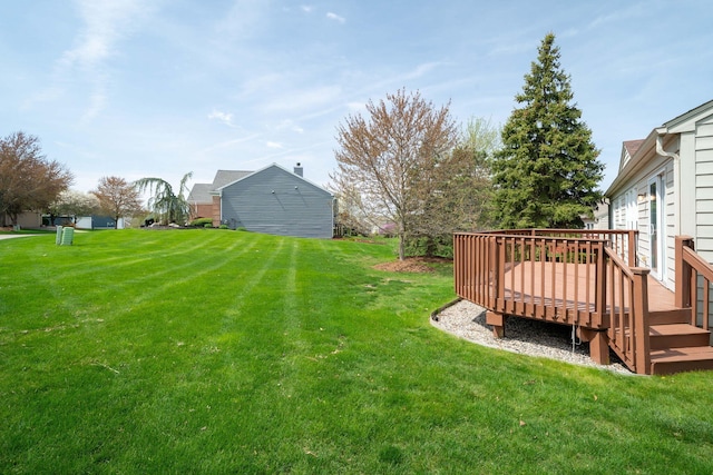 view of yard featuring a wooden deck