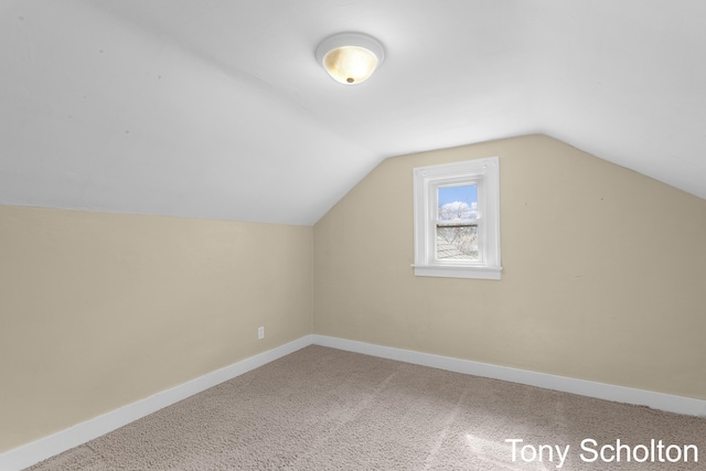 bonus room with carpet flooring, baseboards, and lofted ceiling
