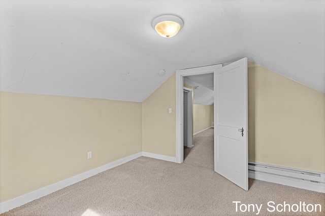 bonus room featuring baseboards, carpet flooring, a baseboard heating unit, and vaulted ceiling