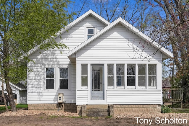 rear view of house with entry steps