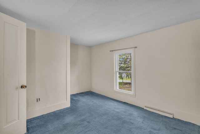 unfurnished room with carpet flooring, a textured ceiling, and a baseboard heating unit