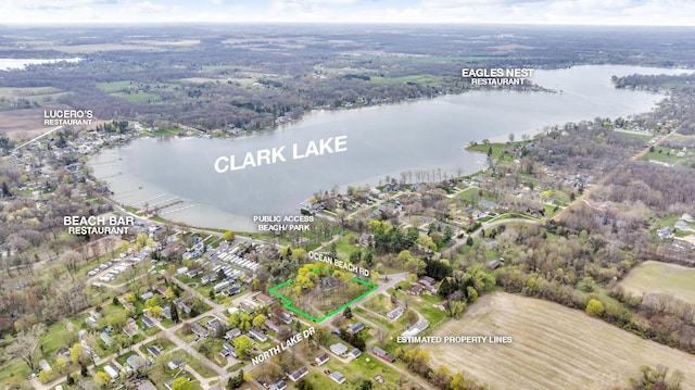 birds eye view of property with a water view