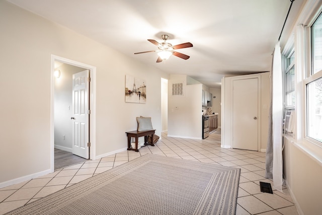 710 Robinwood St, Pontiac, MI 48340 - bedroom with light tile patterned floors, baseboards, and a ceiling fan