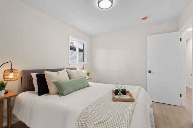 bedroom with light wood finished floors