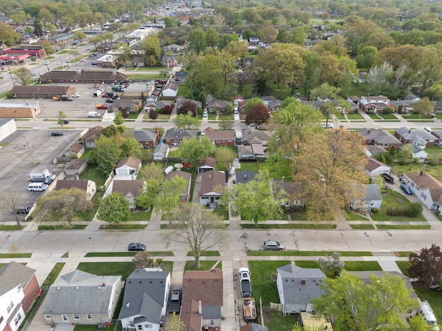 aerial view of property and surrounding area with nearby suburban area