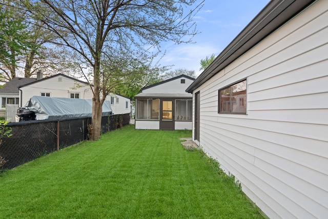 view of yard with a sunroom
