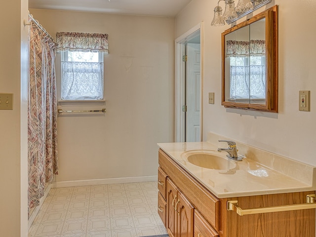 full bathroom with vanity and tile patterned floors