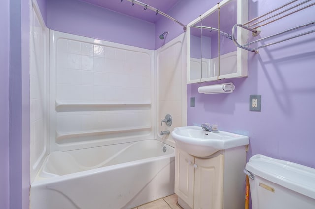bathroom featuring toilet, shower / washtub combination, and vanity