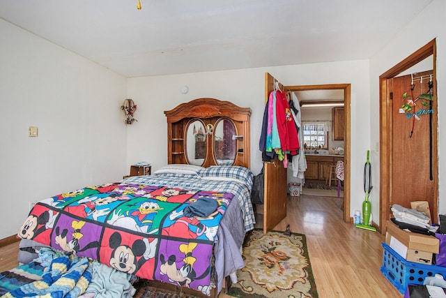 bedroom featuring wood finished floors